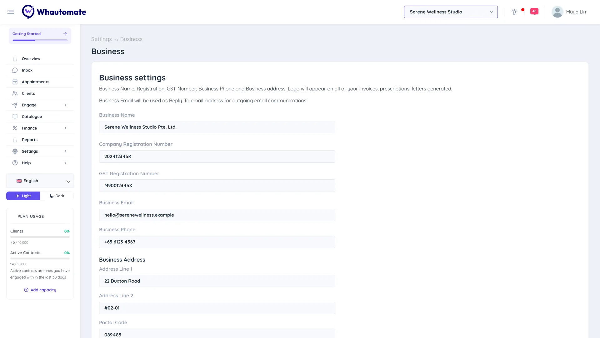 Business settings form with business name, registration and GST numbers, email, phone and the start of the business address